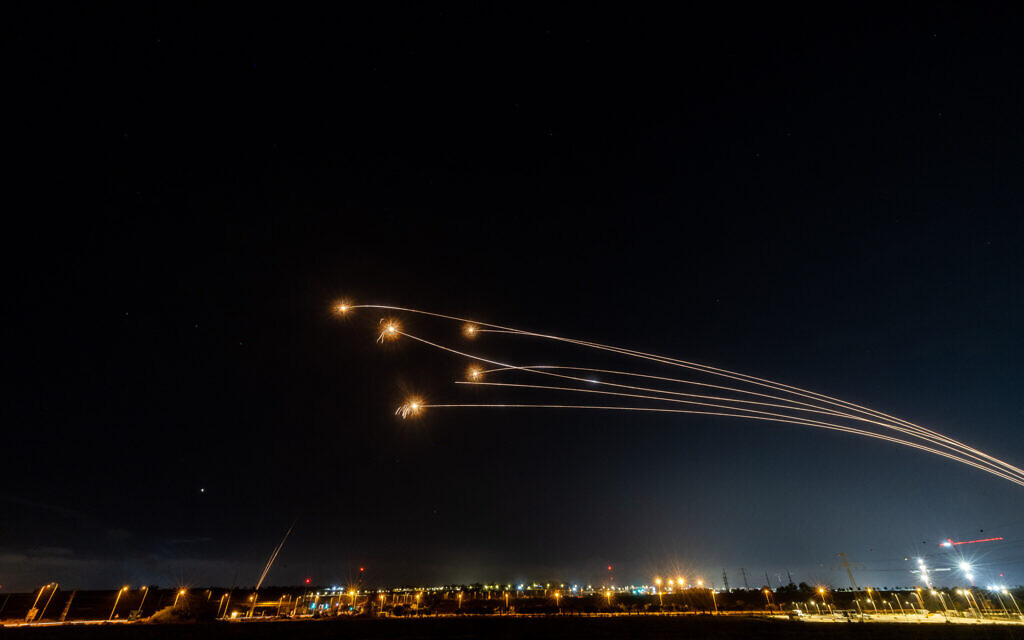 The Iron dome anti-missile system fires interception missiles as rockets are fired from the Gaza Strip into Israel, as seen from Sderot, on May 13, 2023. (Yonatan Sindel/Flash90)
