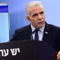 Opposition leader Yair Lapid holds a press conference about the state budget in Tel Aviv, May 16, 2023. (Tomer Neuberg/Flash90)