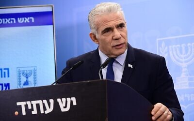 Opposition leader Yair Lapid holds a press conference about the state budget in Tel Aviv, May 16, 2023. (Tomer Neuberg/Flash90)