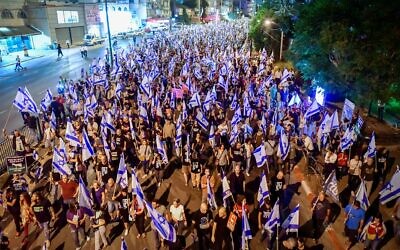 Protesters march in Bnei Brak against the billions in funds provided to ultra-Orthodox parties in the state budget, on May 17, 2023. (Avshalom Sassoni/Flash90)