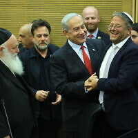 Prime Minister Benjamin Netanyahu (C) shakes hands with National Security Minister Itamar Ben Gvir (R) at the Knesset, alongside other coalition party heads ahead of passing the 2023-2024 state budget vote, May 23, 2023. (Yonatan Sindel/Flash90)