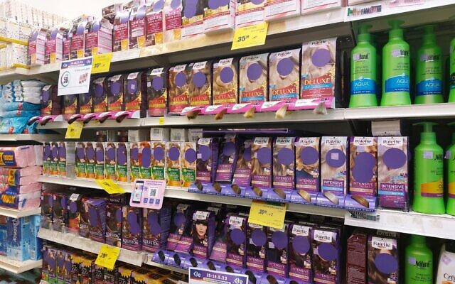 Products at Be Pharmacy with purple stickers covering the faces of women on May 17, 2023. (Twitter account of Stav Ella used in accordance with Clause 27a of the Copyright Law)