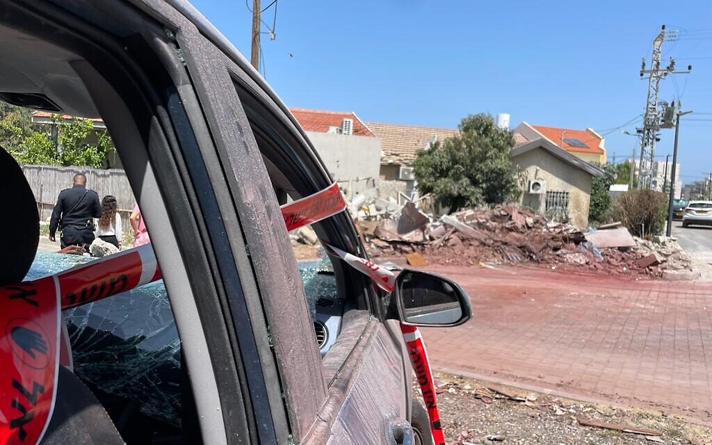 A home and vehicle destroyed on the previous day from a Palestinian Islamic Jihad rocket, Ashkelon, May 11, 2023 (Carrie Keller-Lynn/The Times of Israel)