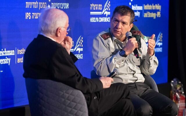 IDF Military Intelligence Directorate chief Aharon Haliva, right, speaks at the Herzliya Conference, May 22, 2023. (Gilad Kavalerchik)
