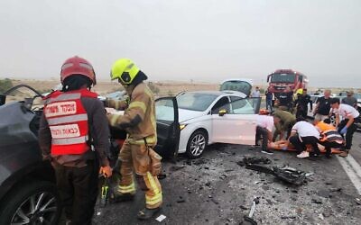 Rescue workers at the scene of a deadly car crash along Route 90 in the West Bank, May 27, 2023. (Fire and Rescue Services)