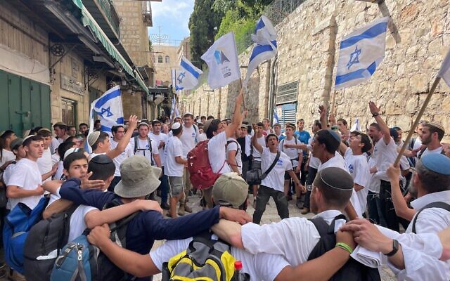 About 100 young men from the West Bank’s Alon More yeshiva dance in Jerusalem's Old City on Jerusalem Day, May 18, 2023. (Carrie Keller-Lynn/Times of Israel)