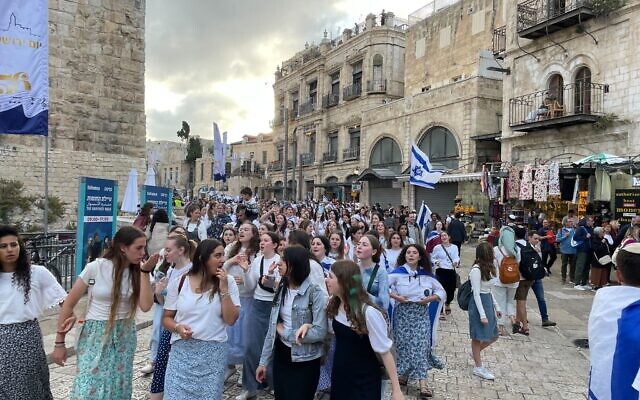 Jerusalem Day Flag March participants walk through the Jaffa Gate into the Old City on May 18, 2023. (Carrie Keller-Lynn/Times of Israel)