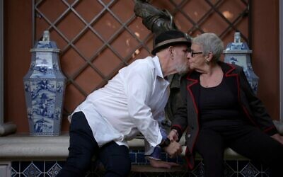 Rabbi Mark Borovitz kisses Harriet Rossetto. (Courtesy)