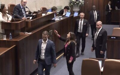 Screen capture from video of May Golan, Minister for the Advancement of Women, center-right, shouting at Yesh Atid MK Merav Ben-Ari, top-left, during a Knesset debate, May 1, 2023. (Channel 12. Used in accordance with Clause 27a of the Copyright Law)