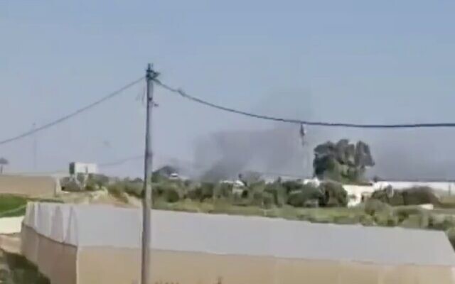 A screenshot from social media video shows smoke rising in the distance after the sound of explosions were heard in southern Gaza, May 9, 2023. (Twitter video screenshot: used in accordance with Clause 27a of the Copyright Law)