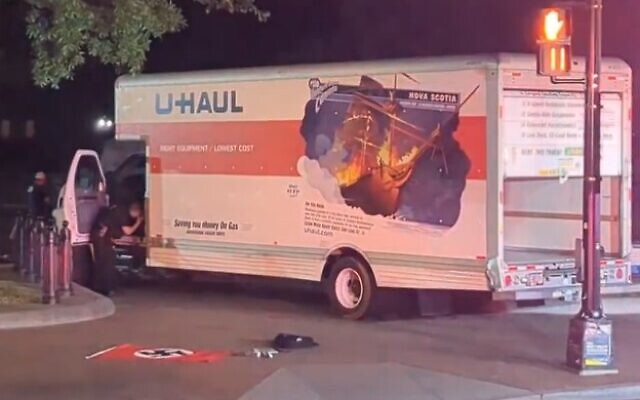 A Nazi flag is seen in front of a box truck that crashed into a security barrier at a park across from the White House, Monday night, May 22, 2023 in Washington. (Screencapture/Twitter)