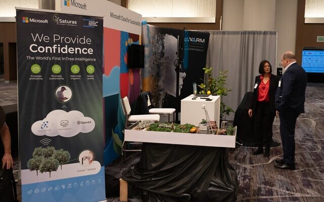 Anat Halgoa Solomon, co-founder and CEO of Saturas showcases the Israeli startup's smart sensor-based precision irrigation system at Microsoft's booth at the World Agri-Tech Innovation Summit in San Francisco in March, 2023. (Courtesy)