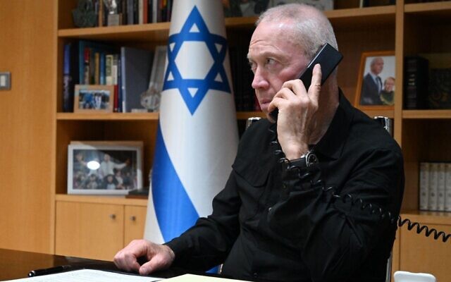 Defense Minister Yoav Gallant on a phone call with mayors and leaders of communities in southern Israel on May 9, 2023 (Ariel Hermoni / Defense Ministry)