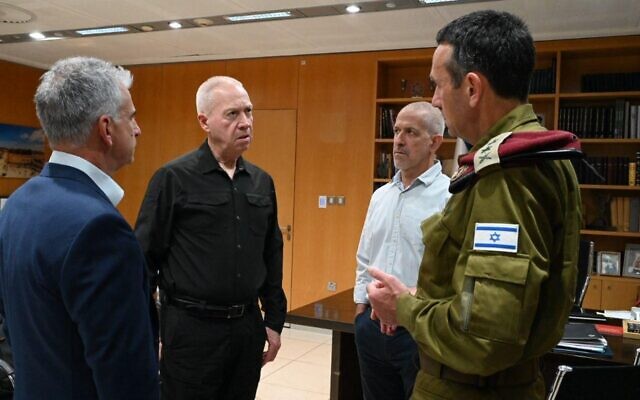 Defense Minister Yoav Gallant (2nd-L) meets IDF Chief of Staff Herzi Halevi (R), Shin Bet chief Ronen Bar (2nd-R) and Mossad head David Barnea at his office in Tel Aviv on May 9, 2023. (Ariel Hermoni/Defense Ministry)