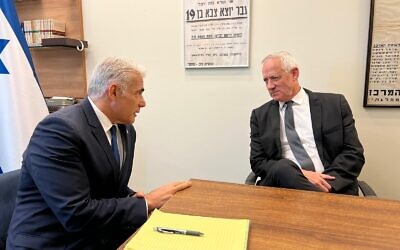 Opposition leader Yair Lapid (left) and National Unity party leader Benny Gantz meet in the Knesset on May 10, 2023. (Courtesy)