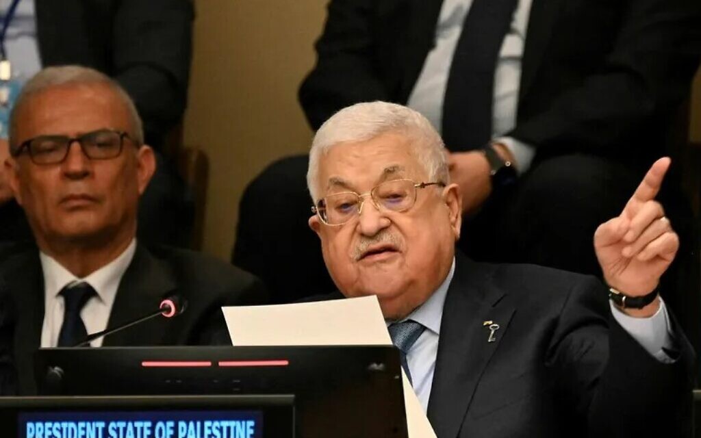 Key in his lapel, Palestinian Authority President Mahmoud Abbas addresses a Nakba Day event at the United Nations General Assembly in New York, May 15, 2023 (Ed Jones / AFP)