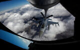 A US Air Force F-16 refuels in mid-flight from a KC-135 Stratotanker during a Red Flag exercise over The Nevada Test and Training Range on February 10, 2014. (John Locher/Las Vegas Review-Journal via AP)