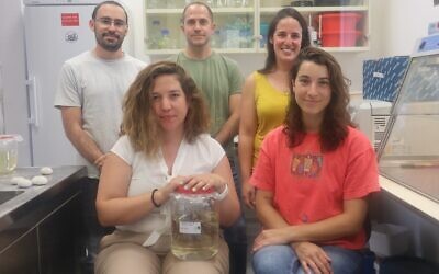Dr Omri Bronstein (standing center, in the back) with his research team. (Tel Aviv University)