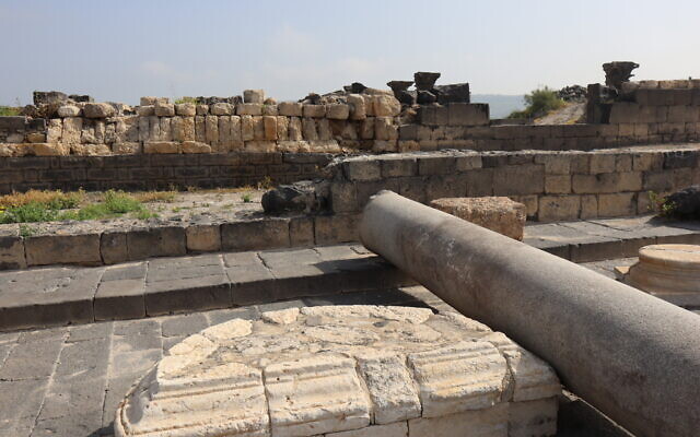 In Sussita, a marble pillar lies next to a platform that likely once held a statue donated by a prosperous couple who moved to Caesarea. (Shmuel Bar-Am)