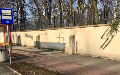 A swastika on the wall of a Jewish cemetery in Oświęcim, Poland, Jan. 10, 2021. (The Memorial and Museum Auschwitz-Birkenau via JTA)
