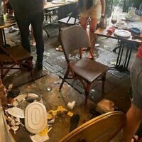 A screenshot from Twitter showing the scene of a Tel Aviv cafe on May 27, 2023, where a woman's screams, following a cockroach sighting, sparked widespread panic as patrons rushed to flee, fearing a terror attack. (Twitter/used in accordance with Clause 27a of the Copyright Law)