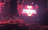 A projection labeling former US president George W. Bush a war criminal and accusing him of lying about his country's invasion of Iraq, at a Roger Waters concert in Birmingham, the United Kingdom, May 31, 2023. (YouTube screenshot: used in accordance with Clause 27a of the Copyright Law)