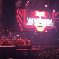 A projection labeling former US president George W. Bush a war criminal and accusing him of lying about his country's invasion of Iraq, at a Roger Waters concert in Birmingham, the United Kingdom, May 31, 2023. (YouTube screenshot: used in accordance with Clause 27a of the Copyright Law)