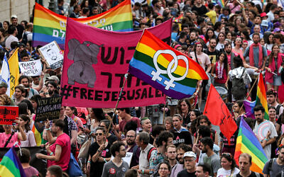 People march during the 21st annual Jerusalem Pride Parade on June 1, 2023. (AHMAD GHARABLI / AFP)