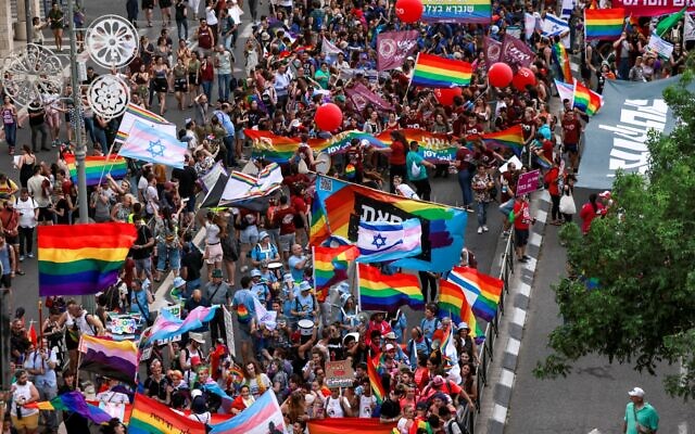People march during the 21st annual Jerusalem Pride Parade in Jerusalem on June 1, 2023. (Menahem KAHANA / AFP)