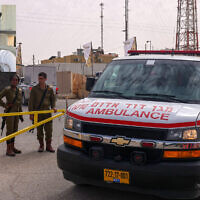 IDF soldiers open a gate for an ambulance outside the Mount Harif military base near the city of Mitzpe Ramon in the southern Negev desert, adjacent to the border with Egypt, on June 3, 2023. The inset photo shows Sgt. Lia Ben Nun, one of three soldiers killed by an Egyptian policeman in a shooting and later clashes. (Menahem Kahana/AFP; Israel Defense Forces)