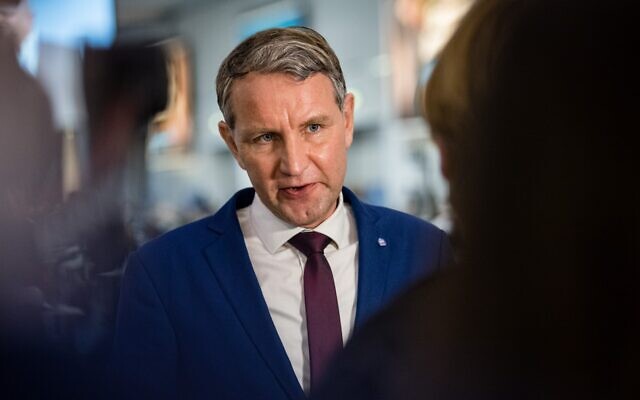 File: Bjoern Hoecke of the far-right Alternative for Germany (AfD) gives a TV interview during a congress for the party in Dresden, eastern Germany. - German prosecutors charged Hoecke on June 5, 2023 with using a banned Nazi slogan in an election campaign. (JENS SCHLUETER / AFP)