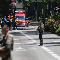 French police officers stand next to an emergency truck following a mass stabbing in Annecy, central-eastern France on June 8, 2023. (OLIVIER CHASSIGNOLE/AFP)