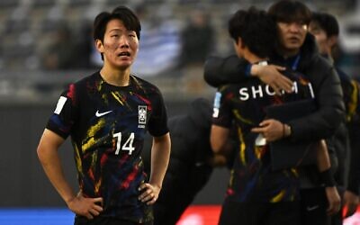 South Korea's midfielder Kang Sang-yoon, right, reacts after losing against Israel in the Argentina 2023 U-20 World Cup third-place match between Israel and South Korea at the Estadio Unico Diego Armando Maradona stadium in La Plata, Argentina, on June 11, 2023. (Luis ROBAYO / AFP)