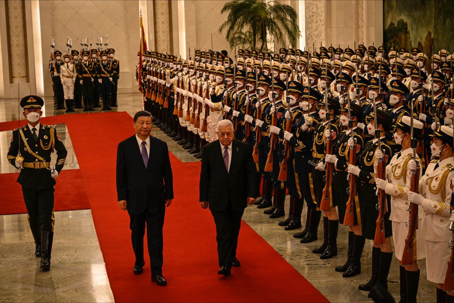 China's President Xi Jinping and Palestinian President Mahmoud Abbas attend a welcoming ceremony at the Great Hall of the People in Beijing on June 14, 2023. (Jade GAO / POOL / AFP)