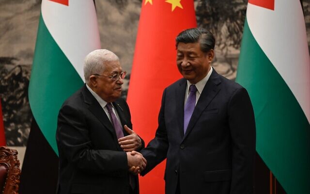 Palestinian Authority President Mahmoud Abbas (left) shakes hands with China's President Xi Jinping after a signing ceremony at the Great Hall of the People in Beijing on June 14, 2023. (Jade GAO / POOL / AFP)