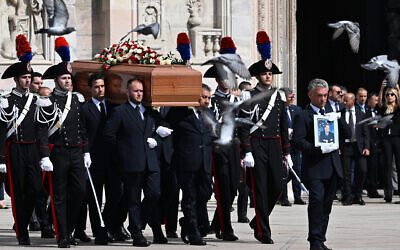Pallbearers carry the coffin of Italy's former prime minister and media mogul Silvio Berlusconi, outside the Duomo cathedral in Milan on June 14, 2023. (Photo by Andreas SOLARO / AFP)