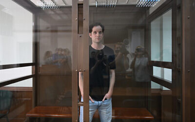 Wall Street Journal reporter Evan Gershkovich stands inside a glass cage before a hearing on his appeal against his extended detention, at the Moscow City Court, in Moscow on June 22, 2023. (Natalia Kolesnikova/AFP)