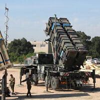 File: Israeli soldiers walk near an Iron Dome defense system (L), a surface-to-air missile (SAM) system, the MIM-104 Patriot (C), and an anti-ballistic missile the Arrow 3 (R) during Juniper Cobra's joint exercise press briefing at Hatzor Air Base in central Israel, on February 25, 2016. (GIL COHEN-MAGEN/AFP)