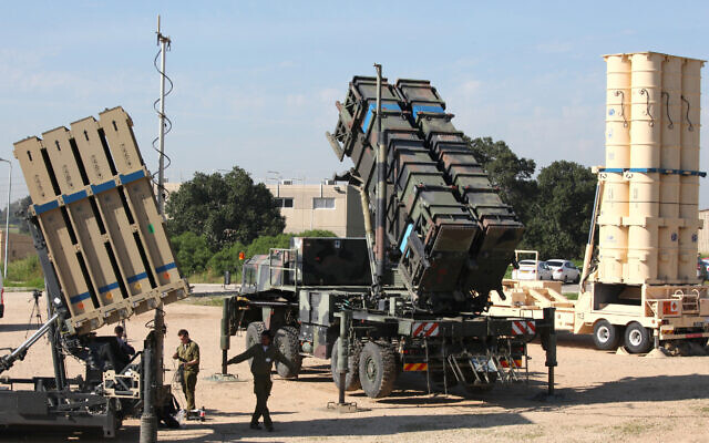 File: Israeli soldiers walk near an Iron Dome defense system (L), a surface-to-air missile (SAM) system, the MIM-104 Patriot (C), and an anti-ballistic missile the Arrow 3 (R) during Juniper Cobra's joint exercise press briefing at Hatzor Air Base in central Israel, on February 25, 2016. (GIL COHEN-MAGEN/AFP)