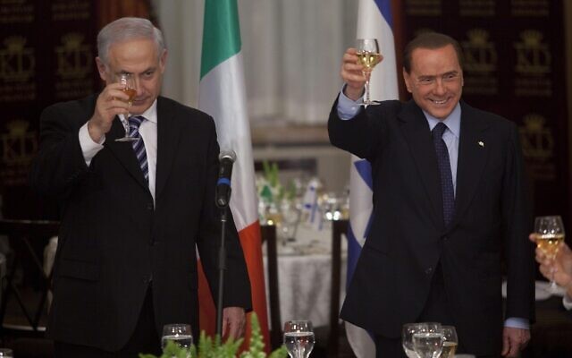 Prime Minister Benjamin Netanyahu, left, raises a toast with Italian Prime Minister Silvio Berlusconi, right, during their meeting in Jerusalem, Monday, Feb. 1, 2010.  (AP Photo/Uriel Sinai, Pool)