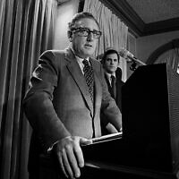 Henry Kissinger tells a White House news conference that "peace is at hand in Vietnam," on Oct. 26, 1972. (AP Photo, File)