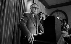 Henry Kissinger tells a White House news conference that "peace is at hand in Vietnam," on Oct. 26, 1972. (AP Photo, File)
