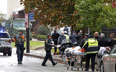 File: First responders surround the Tree of Life Synagogue, rear center, in Pittsburgh, where a shooter opened fire and 11 people were killed in America's deadliest antisemitic attack, Octoer 27, 2018. (AP/Gene J. Puskar)