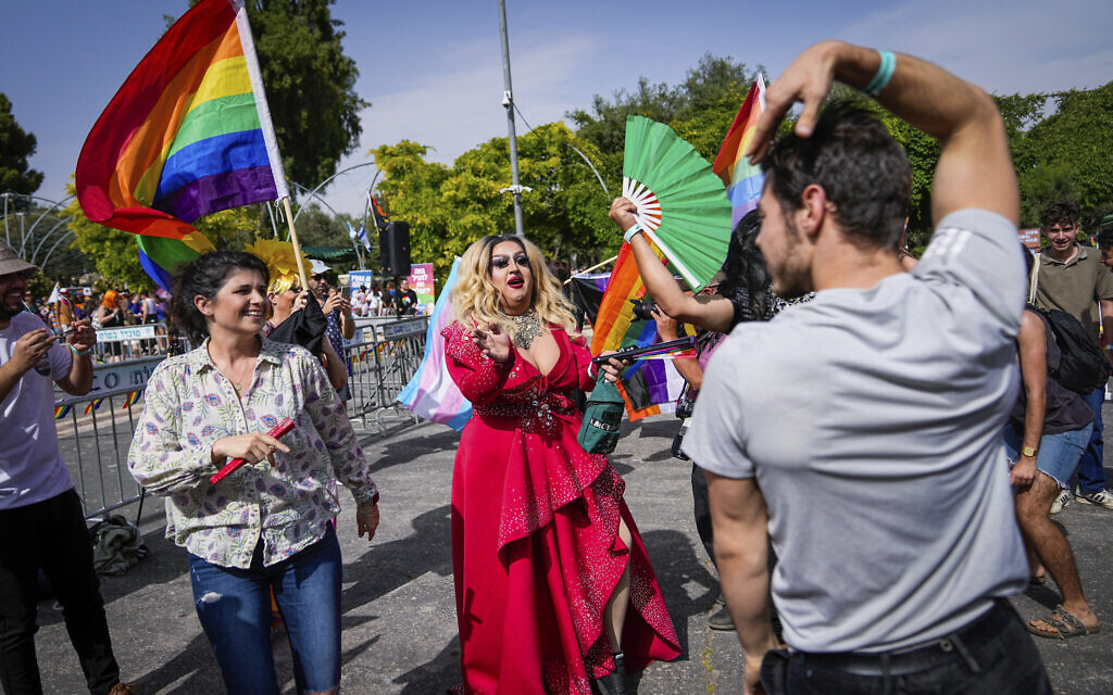Participants dance during the annual Pride parade in Jerusalem, Thursday, June 1, 2023. (AP Photo/Ohad Zwigenberg)