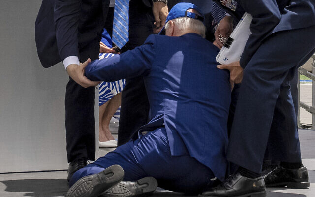 US President Joe Biden falls on stage during the 2023 United States Air Force Academy Graduation Ceremony at Falcon Stadium, June 1, 2023, at the United States Air Force Academy in Colorado Springs, Colorado. (AP Photo/Andrew Harnik)