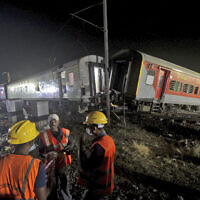 Rescuers work at the site of passenger trains accident, in Balasore district, in the eastern Indian state of Orissa, Saturday, June 3, 2023. (AP Photo)