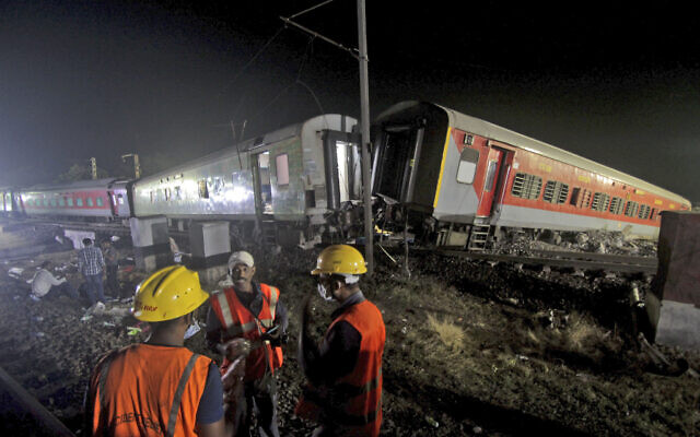 Rescuers work at the site of passenger trains accident, in Balasore district, in the eastern Indian state of Orissa, Saturday, June 3, 2023. (AP Photo)