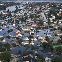 Streets are flooded in Kherson, Ukraine, June 7, 2023, after the Kakhovka dam was blown up. (AP Photo/Libkos)