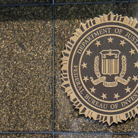 The seal on the J. Edgar Hoover FBI Building is seen June 9, 2023, in Washington. (AP Photo/Alex Brandon)