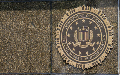 The seal on the J. Edgar Hoover FBI Building is seen June 9, 2023, in Washington. (AP Photo/Alex Brandon)